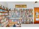 Cozy library corner with floor-to-ceiling bookshelves filled with a diverse collection of books for residents at 5451 Antigua Dr, Zephyrhills, FL 33541