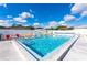 Relaxing pool and chairs with a view of the sky at 5451 Antigua Dr, Zephyrhills, FL 33541