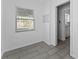 Hallway with new floor leading to the kitchen, enhancing the home's flow and design at 546 90Th N Ave, St Petersburg, FL 33702