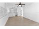 Bright, airy living room with modern tile floors and white walls at 546 90Th N Ave, St Petersburg, FL 33702