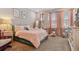 Cozy bedroom with a playful design featuring a comfortable bed and soft carpet at 6129 Marsh Trail Dr, Odessa, FL 33556
