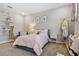 Charming bedroom featuring a comfortable bed, stylish decor, and ample natural light at 6129 Marsh Trail Dr, Odessa, FL 33556