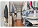 Large walk-in closet with custom organization solutions for clothing, shoes, and accessories at 6129 Marsh Trail Dr, Odessa, FL 33556
