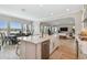 Spacious kitchen with island seating area, open layout with view to dining and living area at 6129 Marsh Trail Dr, Odessa, FL 33556