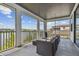 Screened patio featuring outdoor seating, with neighborhood and water views at 6129 Marsh Trail Dr, Odessa, FL 33556