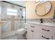 Bathroom featuring tiled shower, toilet, modern vanity, and mirror with stylish finishes at 624 La Jolla Ave, Sun City Center, FL 33573
