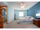 Bedroom offers carpet, a ceiling fan, and ensuite bathroom access, creating a private retreat at 624 La Jolla Ave, Sun City Center, FL 33573