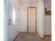 Bright and inviting foyer with a decorative front door and neutral carpeting at 624 La Jolla Ave, Sun City Center, FL 33573