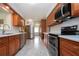 Modern kitchen boasting stainless appliances, granite countertops, new cabinets, and marble floors at 624 La Jolla Ave, Sun City Center, FL 33573