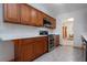 Beautiful kitchen with stainless steel appliances and wood cabinets, ready for your culinary adventures at 624 La Jolla Ave, Sun City Center, FL 33573