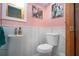 Stylish powder room with pink walls and decorative vanity mirror at 624 La Jolla Ave, Sun City Center, FL 33573