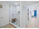 Modern bathroom featuring a glass-enclosed shower and a stylish tile pattern at 628 Cleveland St # 711, Clearwater, FL 33755