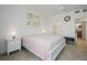 A cozy bedroom features a walk in closet and ensuite bathroom at 628 Cleveland St # 711, Clearwater, FL 33755