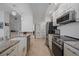 Modern kitchen features stainless appliances, granite countertops, and a farm sink at 628 Cleveland St # 711, Clearwater, FL 33755