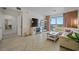 Stylish living room featuring modern decor, herringbone floors, and a sliding glass door to a balcony at 628 Cleveland St # 711, Clearwater, FL 33755