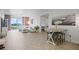 Spacious living room and dining area showcasing modern decor and balcony access at 628 Cleveland St # 711, Clearwater, FL 33755