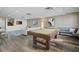 Large recreation room with pool table, comfortable seating, and stylish decor at 628 Cleveland St # 711, Clearwater, FL 33755