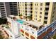 Stunning rooftop pool and lounge area with pergolas in a modern high-rise condo building at 628 Cleveland St # 711, Clearwater, FL 33755