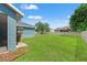 Well-maintained backyard with green grass and partial view of the home's exterior at 6324 35Th Avenue E Cir, Palmetto, FL 34221