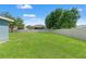 Expansive backyard featuring a lush lawn and a secure privacy fence, perfect for outdoor activities at 6324 35Th Avenue E Cir, Palmetto, FL 34221
