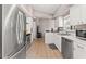 Functional kitchen with white cabinetry, tile flooring, stainless steel appliances, and ample counter space at 6324 35Th Avenue E Cir, Palmetto, FL 34221