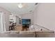 Comfortable living space showcasing a large sectional sofa, a TV, and an open layout to the kitchen at 6324 35Th Avenue E Cir, Palmetto, FL 34221