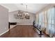 Spacious living room featuring hardwood floors, large windows, neutral paint, and ample space for activities at 6324 35Th Avenue E Cir, Palmetto, FL 34221