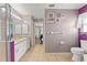 This main bathroom features dual sinks, tile floors, a glass shower, and a toilet at 6324 35Th Avenue E Cir, Palmetto, FL 34221
