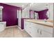 Bright main bathroom with dual sinks, tile floors, a glass shower, and a separate tub at 6324 35Th Avenue E Cir, Palmetto, FL 34221