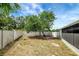 Backyard has new vinyl fencing, lush trees and access to the side of the home, allowing for privacy at 6601 13Th N St, St Petersburg, FL 33702