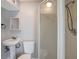 Bathroom with pedestal sink, toilet and shower with glass door at 6601 13Th N St, St Petersburg, FL 33702