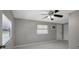 Bedroom featuring ceiling fan, mini-split A/C, and tile flooring at 6601 13Th N St, St Petersburg, FL 33702