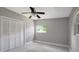 Bedroom with ceiling fan, closet, and window at 6601 13Th N St, St Petersburg, FL 33702