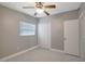 Bedroom with ceiling fan, closet and window at 6601 13Th N St, St Petersburg, FL 33702