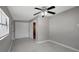 Bedroom featuring a ceiling fan, tile flooring, and closet at 6601 13Th N St, St Petersburg, FL 33702