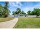 Charming single-story home with a well-maintained lawn and white picket fence at 6601 13Th N St, St Petersburg, FL 33702