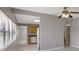 Bright living room with tile floors, ceiling fan, and view of the kitchen at 6601 13Th N St, St Petersburg, FL 33702