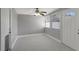Bright living room with tile floors, a ceiling fan, and natural light at 6601 13Th N St, St Petersburg, FL 33702