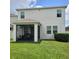 Backyard with a screened lanai and green lawn at 7563 Ashcroft Dr, Wesley Chapel, FL 33545