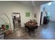 Open dining area features wood floors and an eclectic selection of art and decorations throughout at 7563 Ashcroft Dr, Wesley Chapel, FL 33545