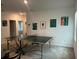 Spacious game room with ping pong table and large artwork at 7563 Ashcroft Dr, Wesley Chapel, FL 33545