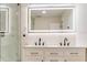Bright bathroom featuring a double sink vanity, modern lighting, and elegant finishes at 7620 N 74Th St, Pinellas Park, FL 33781