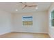 Comfortable bedroom featuring hardwood floors, fresh paint, modern lighting, and ample natural light at 7620 N 74Th St, Pinellas Park, FL 33781