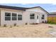 A bright home featuring a modern exterior, fresh landscaping, and an inviting entrance at 7620 N 74Th St, Pinellas Park, FL 33781