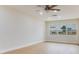 Bright and spacious living room offering hardwood floors, fresh paint, modern lighting, and ample natural light at 7620 N 74Th St, Pinellas Park, FL 33781