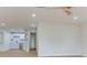 Open-concept living space with modern lighting, fresh paint, and a view into the updated kitchen at 7620 N 74Th St, Pinellas Park, FL 33781