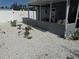 Backyard with a crushed shell ground cover, a patio and white privacy fence at 7800 125Th St, Seminole, FL 33772