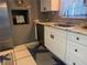 Stylish kitchen featuring stainless steel appliances, granite countertops, and white cabinetry with modern hardware at 7800 125Th St, Seminole, FL 33772