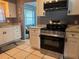 Bright kitchen featuring stainless steel appliances, white cabinets, and light countertops at 7800 125Th St, Seminole, FL 33772