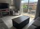 Cozy living room with neutral tones, sliding glass doors to the patio, and a fireplace for warmth at 7800 125Th St, Seminole, FL 33772